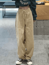 Pantalones rectos con bolsillo y cintura alta